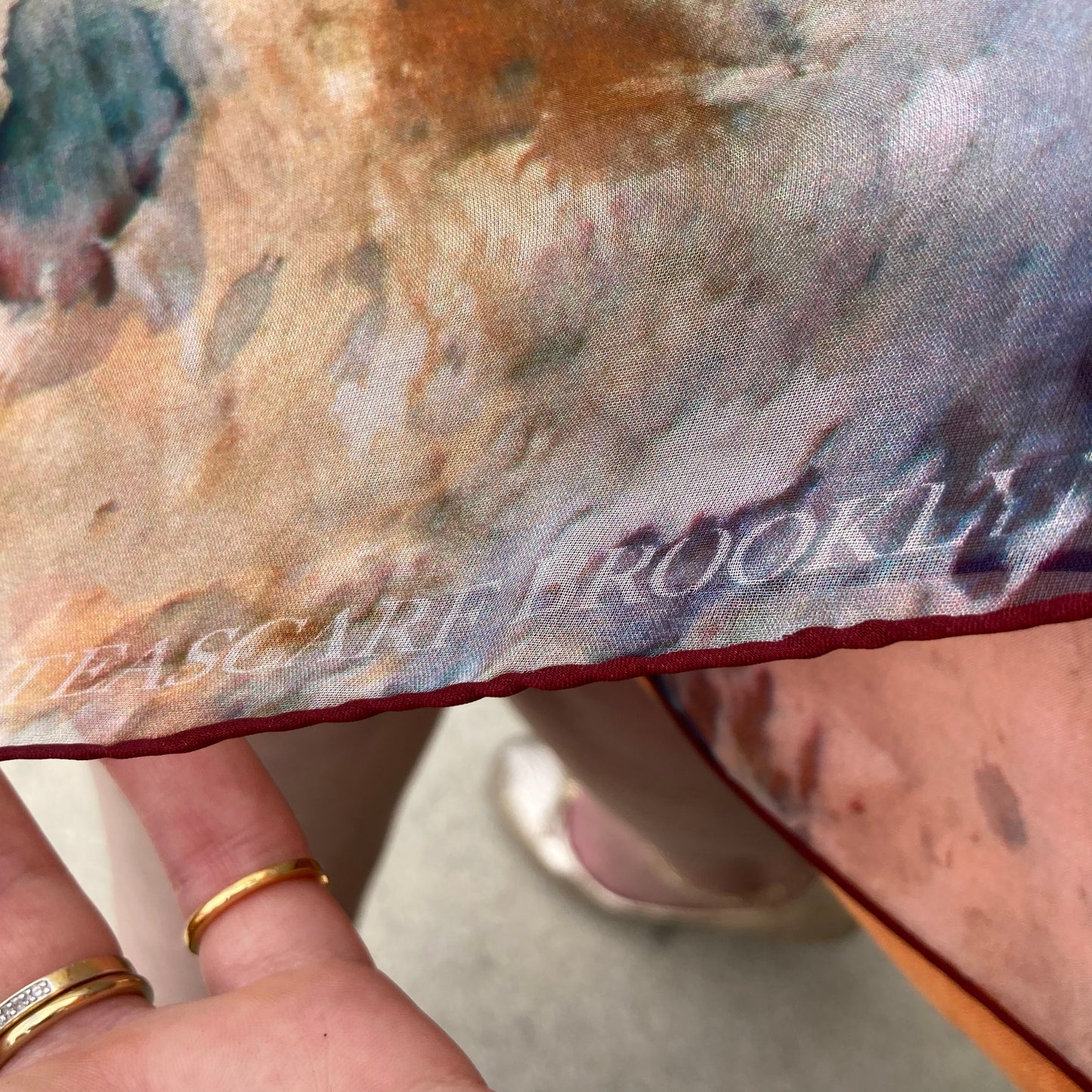 Detail of logo on Rare Earth Small Square Tea-Printed Silk Chiffon Scarf - 100% Silk, 24" x 24" - Teascarf Brooklyn