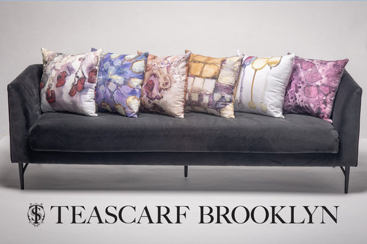 Tea-printed art pillow covers on a couch — Teascarf Brooklyn
