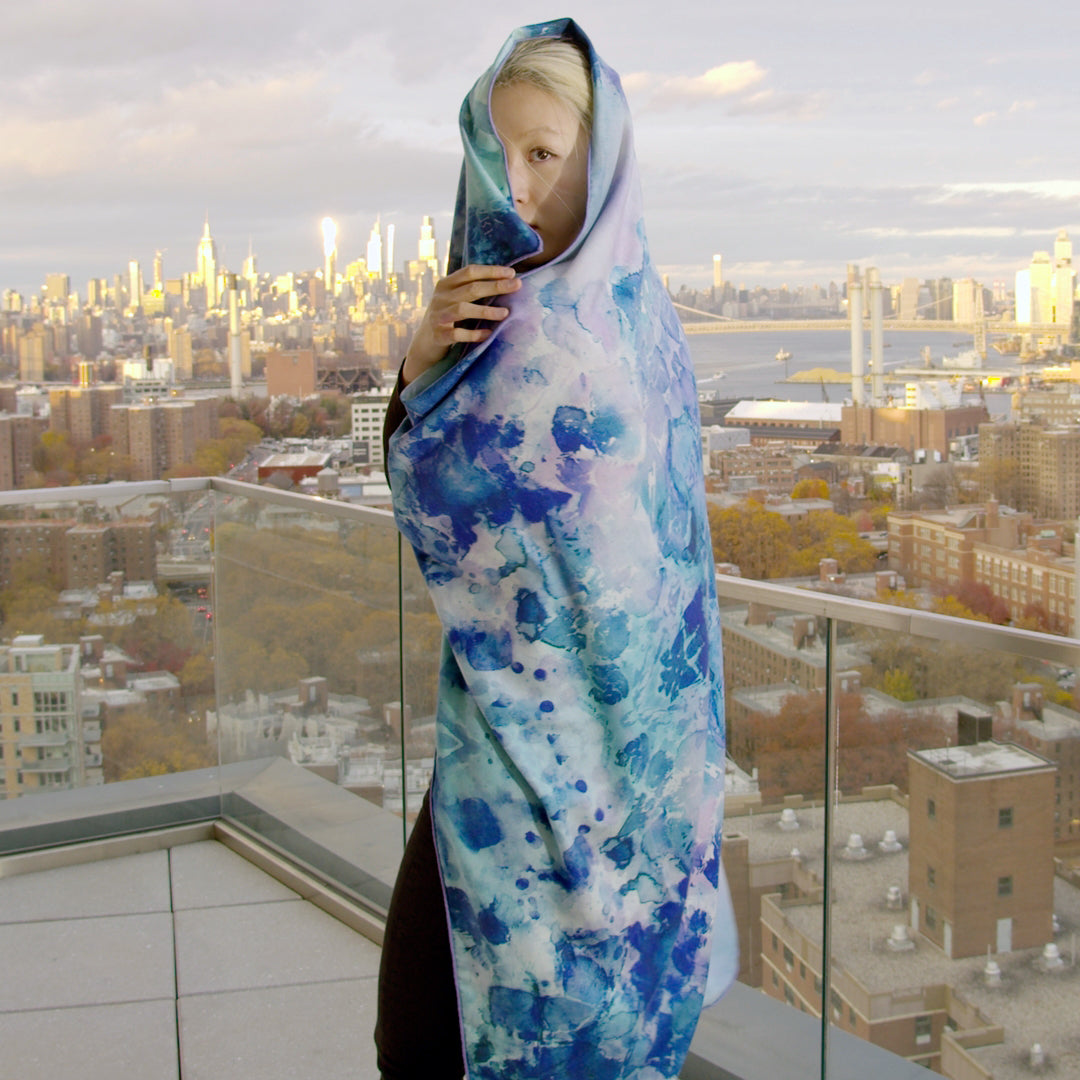 Model wrapped in the Peacock Green oversized silk-wool art scarf