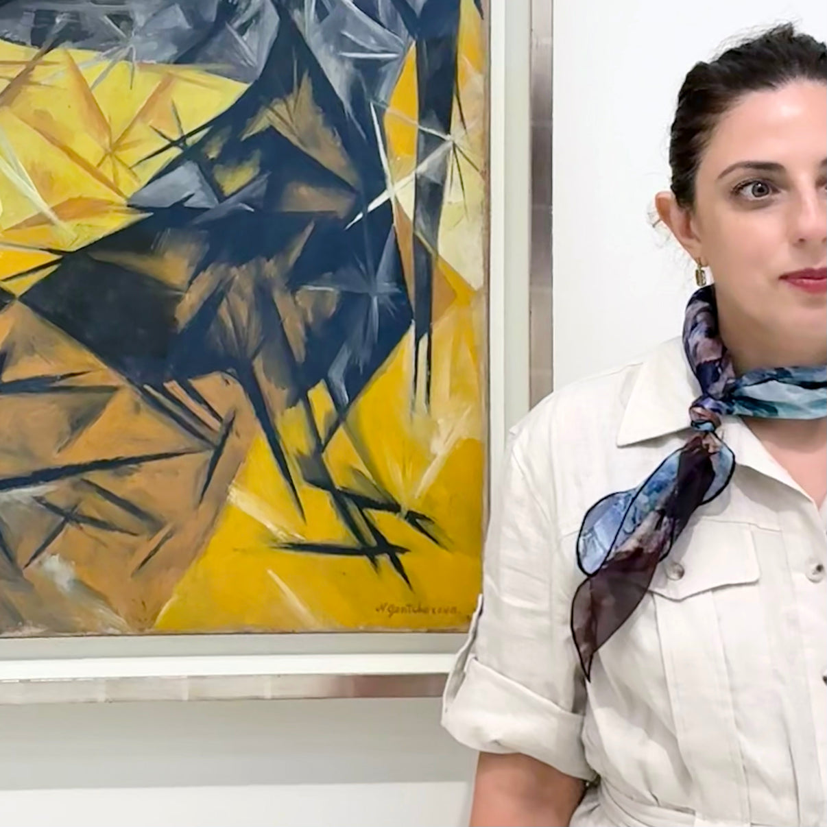 Model wearing Blue Dream Small Square Tea-Printed Silk Chiffon Scarf tied at the neck in a gallery setting - 100% Silk, 24x24" - Teascarf Brooklyn