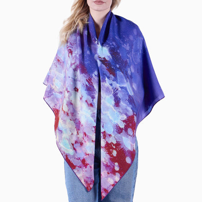 Studio photogrph of front view of model with Oversized Purple Rain Sarf draped over her shoulders.