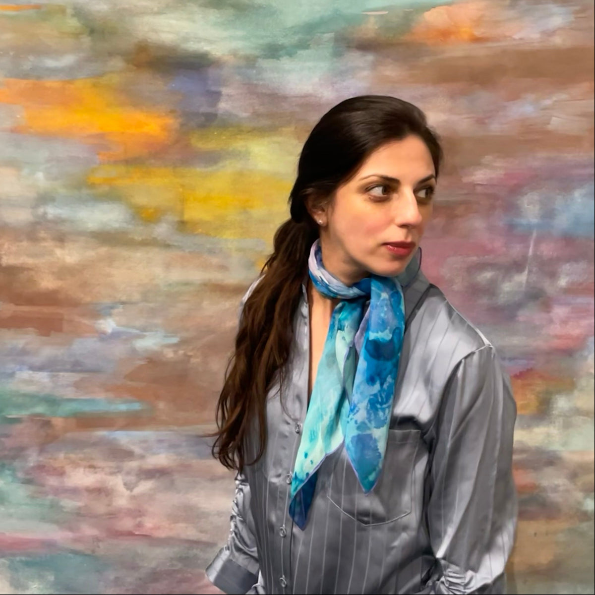 Model in front of painting wearing Peacock Green Small Square Tea-Printed Silk Chiffon Scarf - 100% Silk, 26" x 26" - Teascarf Brooklyn
