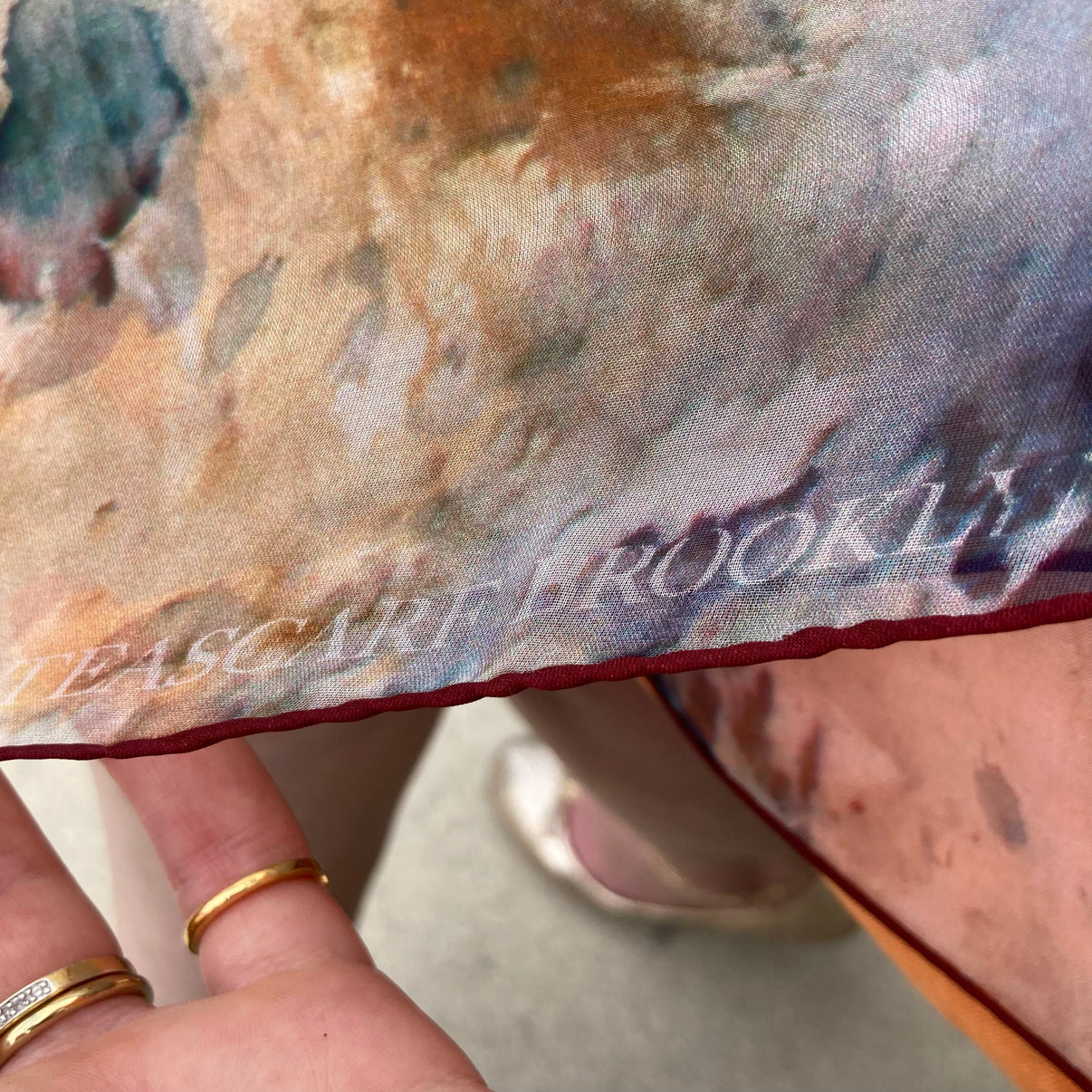 Detail of logo on Rare Earth Small Square Tea-Printed Silk Chiffon Scarf - 100% Silk, 26" x 26" - Teascarf Brooklyn