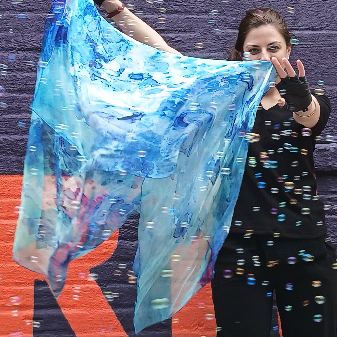 Model holding Clear Blue Oversized Square Tea-Printed Silk Scarf - 100% Silk, 52x52" - Teascarf Brooklyn