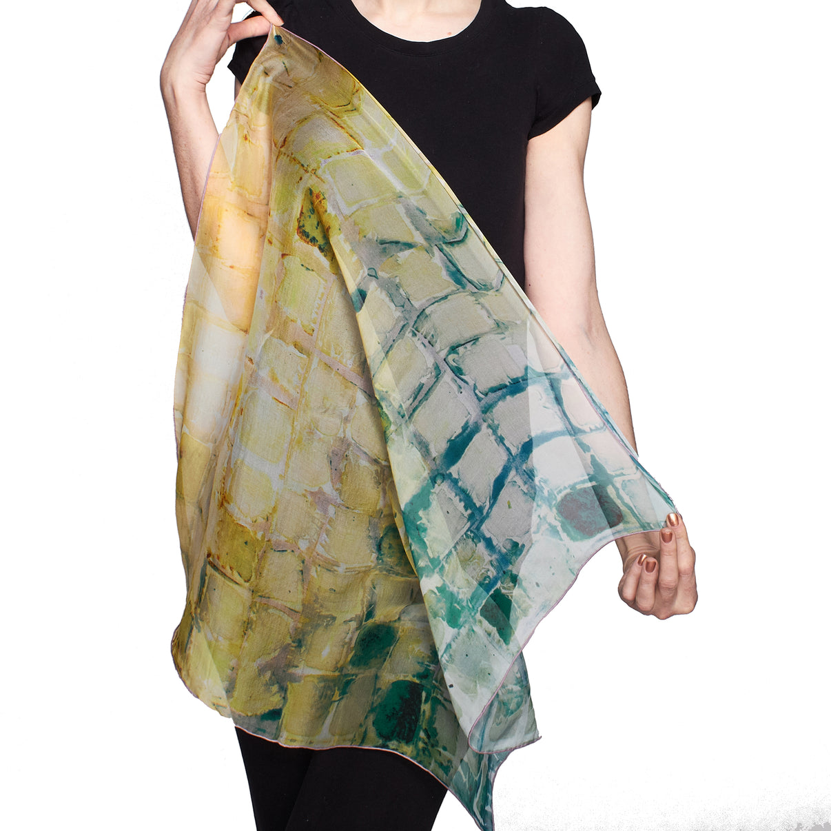 Model holds sheer Calm Camomile Small Square Tea-Printed Silk Chiffon Scarf - 100% Silk, 26" x 26" - Teascarf Brooklyn