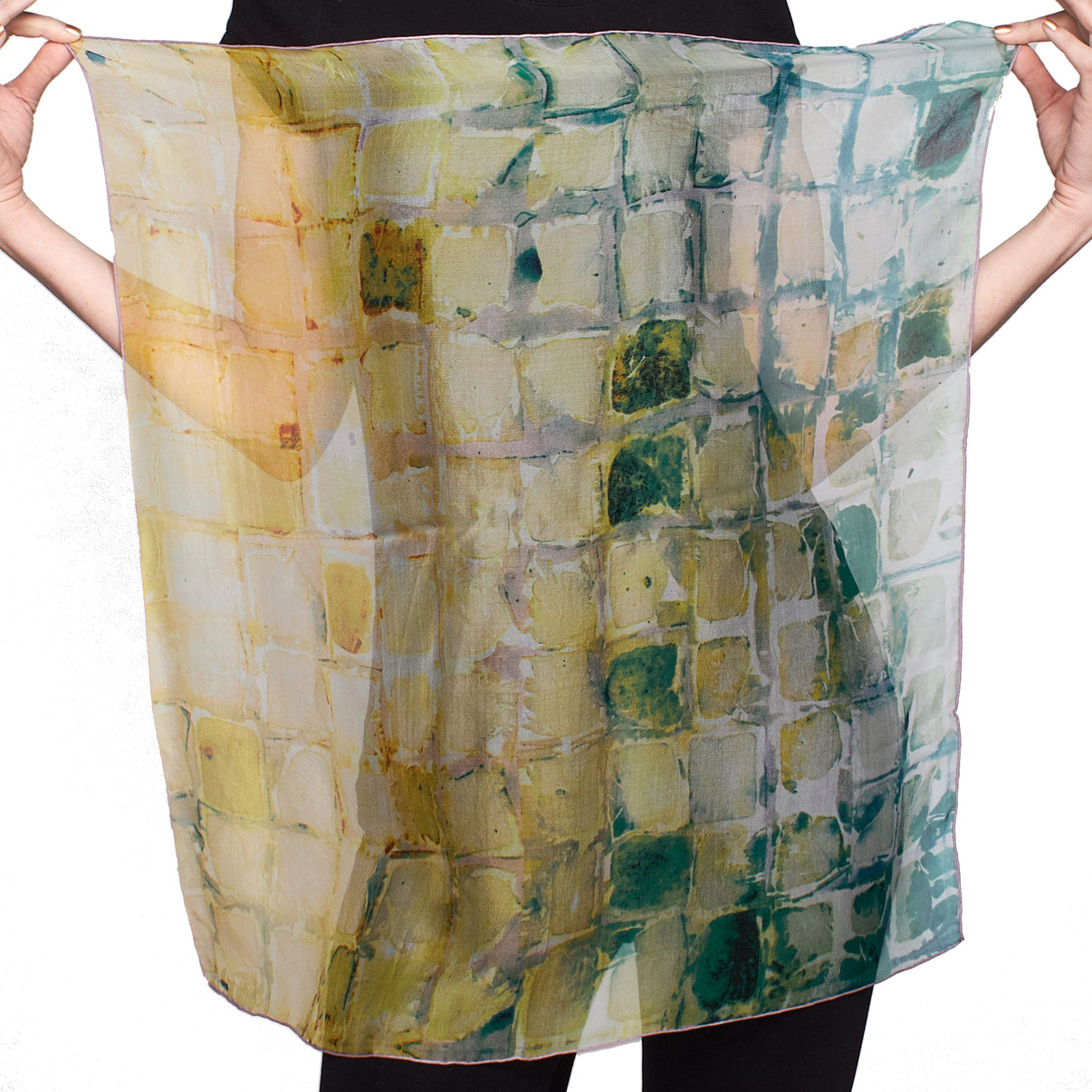 Model holds sheer Calm Camomile Small Square Tea-Printed Silk Chiffon Scarf - 100% Silk, 26 x 26" - Teascarf Brooklyn