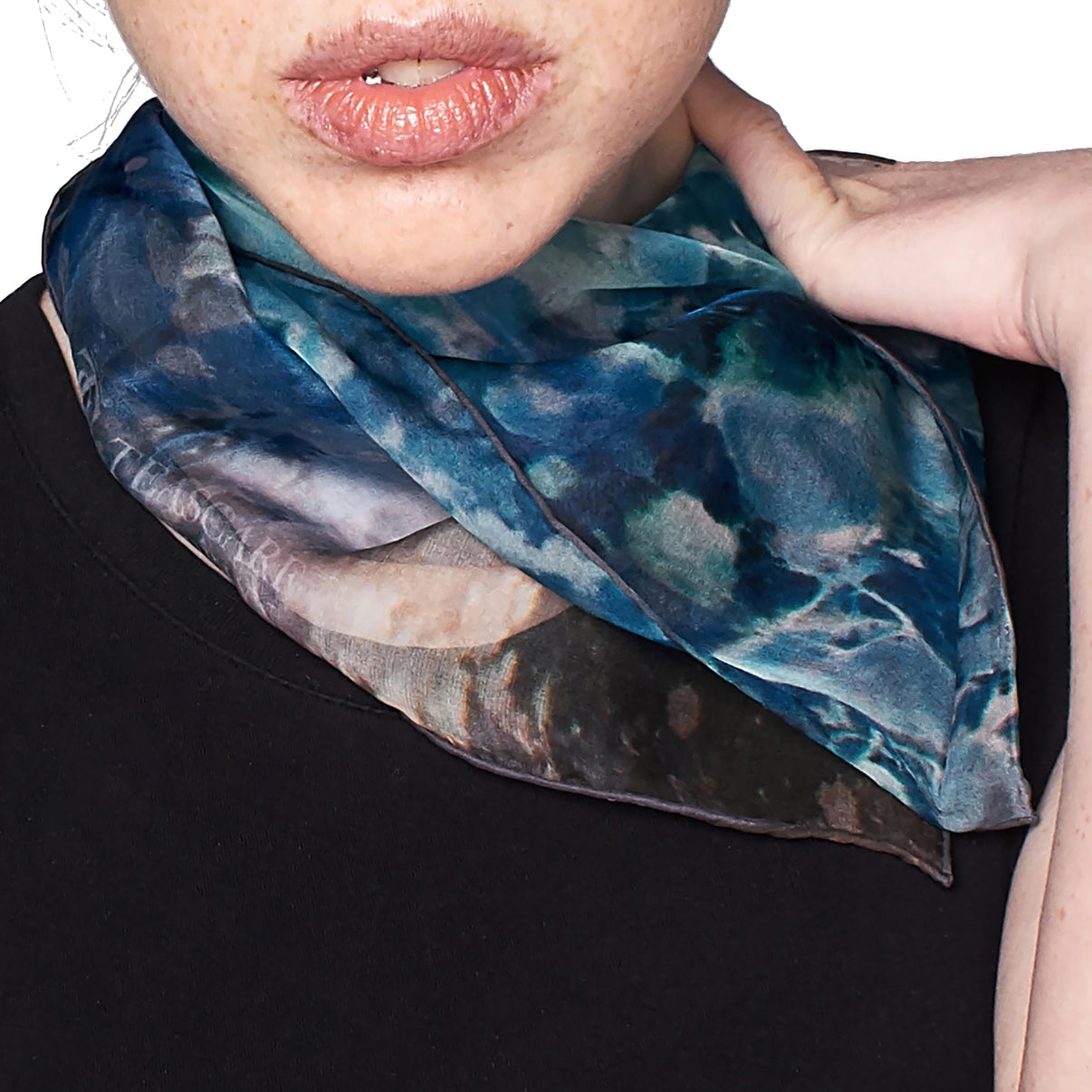 Close-up of model wearing Blue Dream Small Square Tea-Printed Silk Chiffon Scarf tied at the neck - 100% Silk, 24x24" - Teascarf Brooklyn